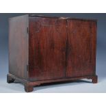 A 19th Century mahogany apprentice piece two door cabinet, the doors with carved detail to the