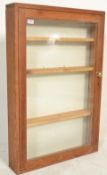 A vintage 20th Century pine glass fronted apothecary / shop display wall hanging storage display