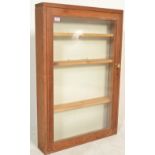 A vintage 20th Century pine glass fronted apothecary / shop display wall hanging storage display