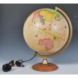 A late 20th Century desk top light up globe having coloured countries on a parchment design globe
