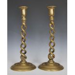 A pair of 19th Century Victorian altar style barleytwist candlesticks, the double barley twist stems