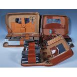 A group of three vintage 20th Century Gentleman's travelling cased vanity sets having chrome and