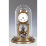 An early 20th Century brass anniversary clock having a white enamel face with Arabic numeral chapter