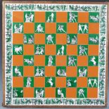 A vintage 20th Century wooden chess board set with coloured ceramic tiles having Greek style