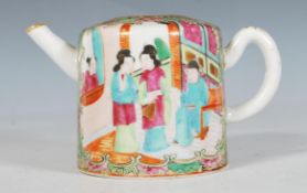 A 19th Century Chinese canton tea pot of small proportions being hand painted with green and pink