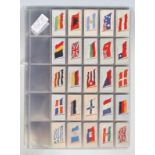 A selection of vintage Player's military related cigarette cards to include eight full sets; flags