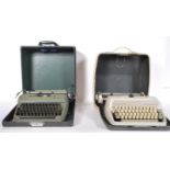 A vintage 20th Century Olympia portable typewriter in original fitted carry case together with a