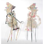 A  pair of believed late 19th Century / early 20th century Indonesian shadow puppets being hand