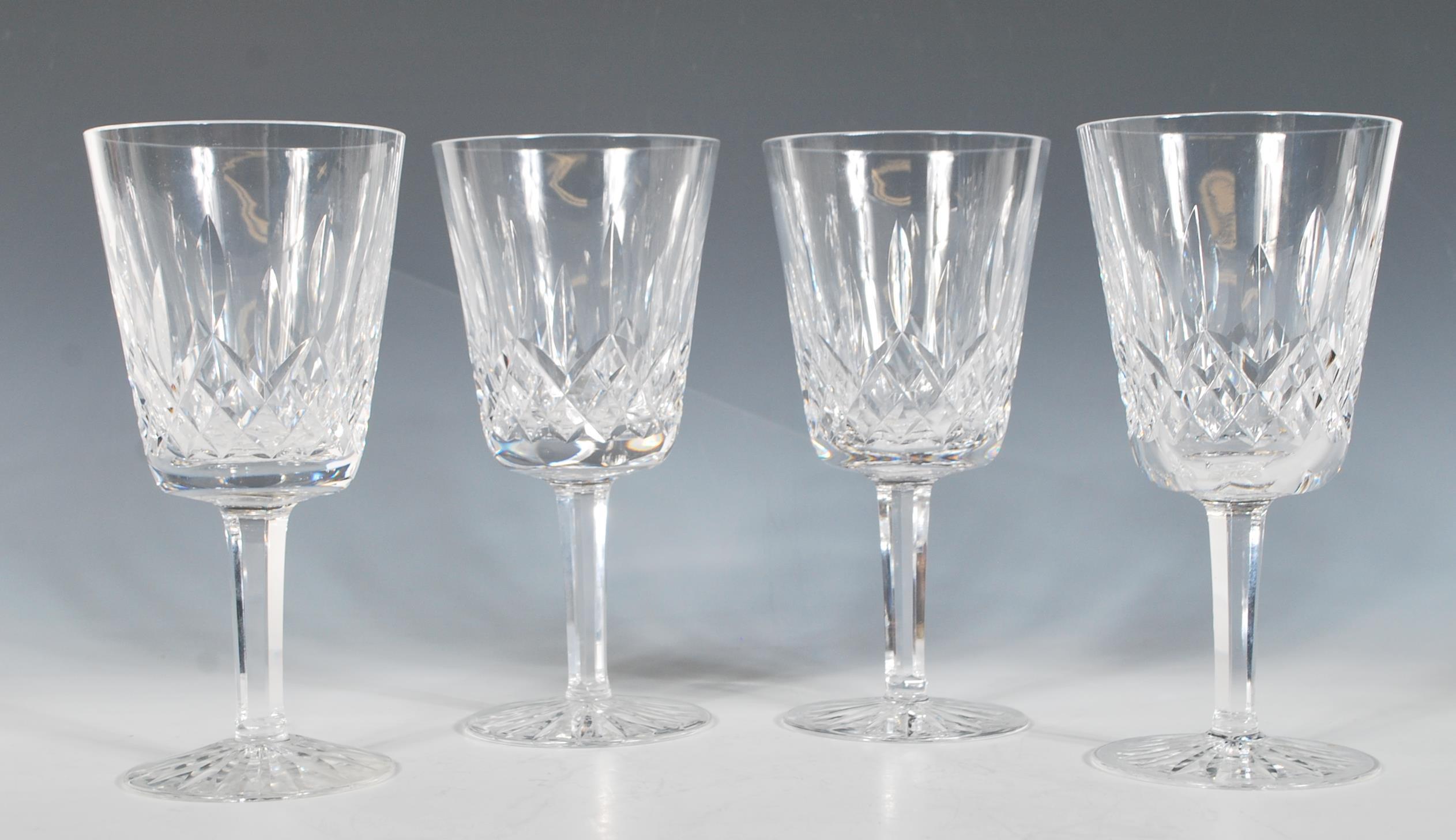 A set of four Waterford crystal cut glass goblet / wine glasses in the 'Lismore' pattern having