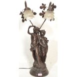 A 20th Century bronzed table lamp modelled in a classical style depicting young lovers in partial