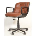 After Charles Pollock - A retro Italian executive type swivel desk chair having a black plastic