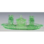 An early 20th Century Art Deco 1930's green glass dressing table vanity set consisting of oval
