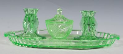 An early 20th Century Art Deco 1930's green glass dressing table vanity set consisting of oval