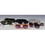 A collection of designer sunglasses mostly Ray Ban, prescription Ray Ban and Prad, Vogue sunglasses.