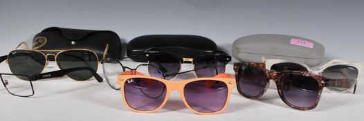 A collection of designer sunglasses mostly Ray Ban, prescription Ray Ban and Prad, Vogue sunglasses.