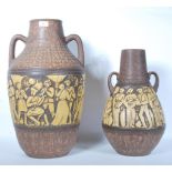 A pair of vintage retro West German studio pottery graduating floor standing vases / stick stands,