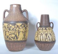 A pair of vintage retro West German studio pottery graduating floor standing vases / stick stands,