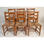 A set of 6 Victorian 19th century country beech wood chapel chairs. Raised on turned legs with