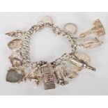 A silver hallmarked charm bracelet fitted with fifteen charms to include Blackpool Tower,