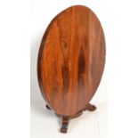 A 19th century Victorian rosewood large tilt top breakfast / loo dining table. Raised on a trefoil