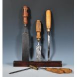 A small selection of vintage woodworking tools to include mostly chisels, brass topped screw and a