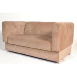 A Danish style mid century modular two seat sofa settee. Original upholstered frame with barrel arms