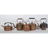 A group of four decorative copper kettles dating from the 19th Century and latter to include