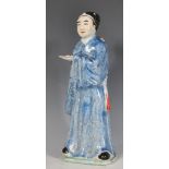 A 20th Century Chinese figure in the form of a scholar having a blue glazed robes with black