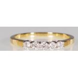 An 18ct yellow gold five stone diamond ring of approx 30pts. Hallmarked 750 for Sheffield. Ring size