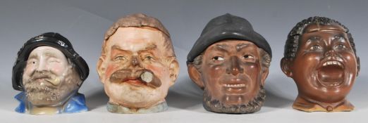 A collection of four Austrian / German ceramic novelty tobacco jars in the manner of Bernard Bloch