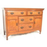 A late 19th Century high Victorian walnut sideboard credenza, flared top over a configuration of