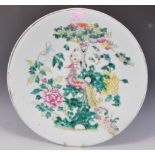 A large 19th Century Chinese Canton wall charger plate of round form having a celadon ground,