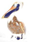 A Royal Crown Derby large Brown Pelican paperweight with gold stamp to base, approx 13cm high, in
