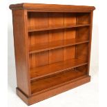A Victorian 19th century solid oak open window library bookcase. Raised on a plinth base having an