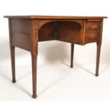 An Edwardian Industrial oak office desk of unusual form being raised on turned legs with pad feet,