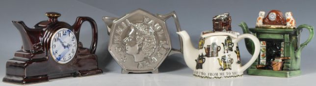 A group of four Cardew collectors teapots to include mantel clock teapot, a Victorian fireplace