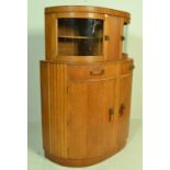 A 1930's Art Deco oak bow front sideboard / display cabinet. The twin bow front glass double door