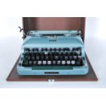 A vintage 20th Century Imperial Good Companion 5 portable typewriter, enamel body cased within its