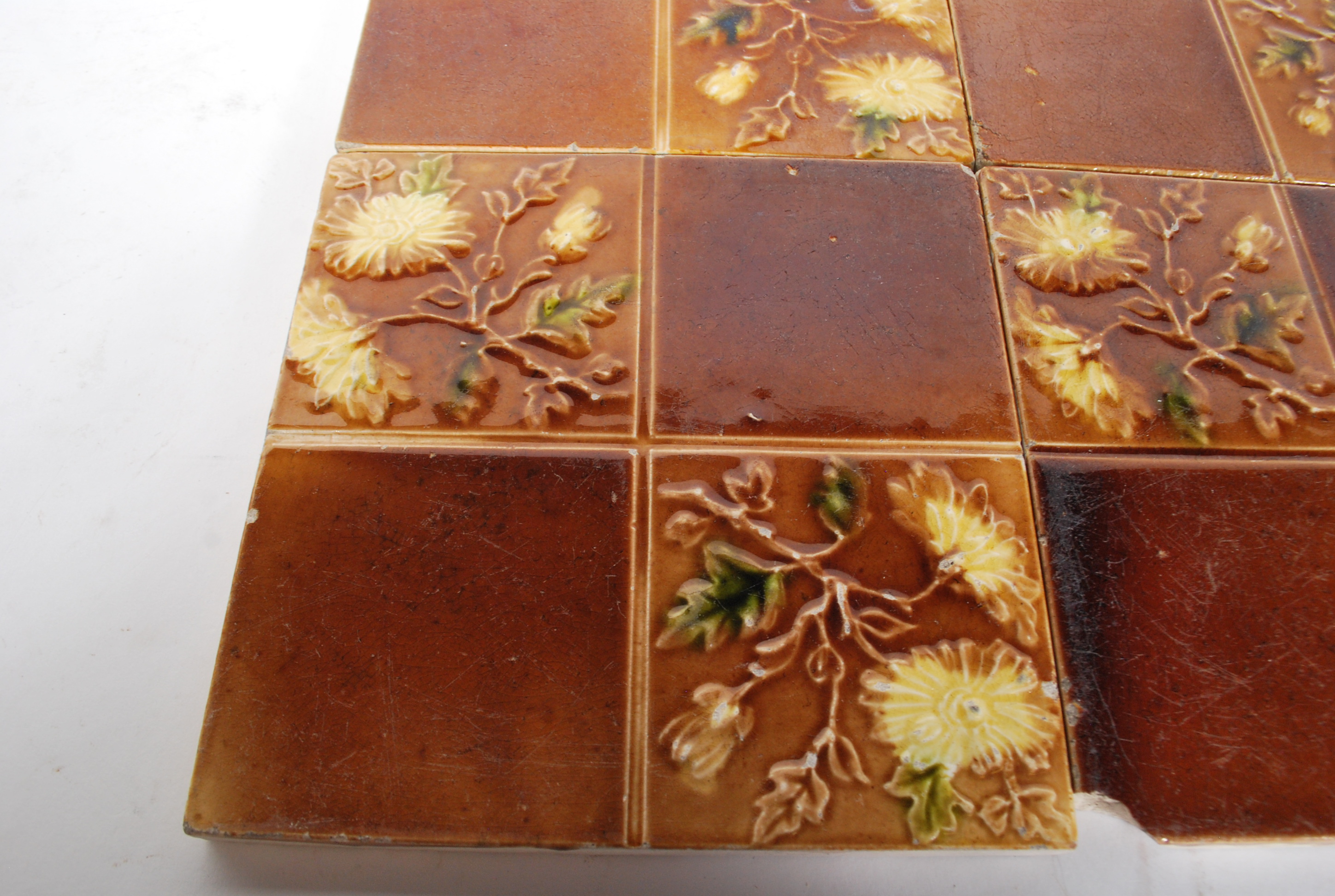 A set of four Victorian Staffordshire majolica tiles each of sectional design having floral - Image 2 of 6