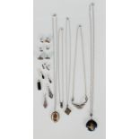 A selection of silver jewellery to include a pendant necklace set with a white stone, an engine