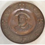 A 19th century large French copper wall charger plate commemorating King Francois I having a