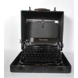 A vintage 20th Century portable Remington Noiseless typewriter complete  with fitted case, serial No