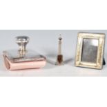 A selection of silver items to include a stamped 925 miniature photo frame with repousse decoration,