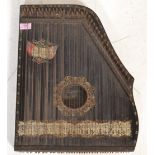 A early 20th Century ' The International ' guitar zither musical instrument having an ebonised