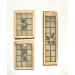 A set of three Victorian leaded stain glass windows. Each window having central stained floral