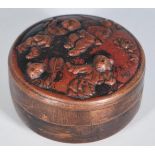 An early 20th Century Chinese copper snuff pot / box of round form having repousse decoration to the