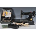 A 20th Century vintage Singer Featherlite 221K sewing appears complete with accessories / manual