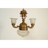 A 19th Century antique rise and fall lamp having a brass body with central knopped column above a