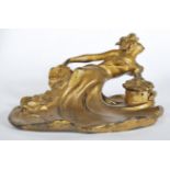 A late 19th Century / early 20th Century French Art Nouveau gilded cast metal inkwell in the form of