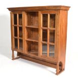 A large 20th century Georgian style dresser cabinet of freestanding form with a series of glass